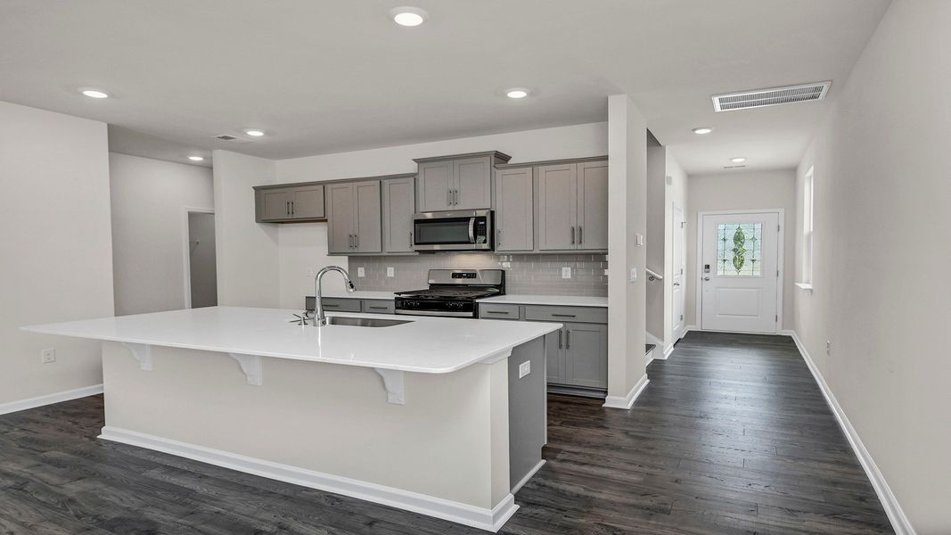 Representative furnished interior of a home built from the MANNING by D.R. Horton in Sease's Pond, Gilbert (Image 4).