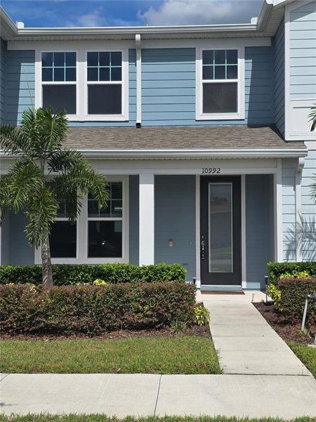 Front exterior of a new home in , Orlando, FL, highlighting curb appeal (Image 1).