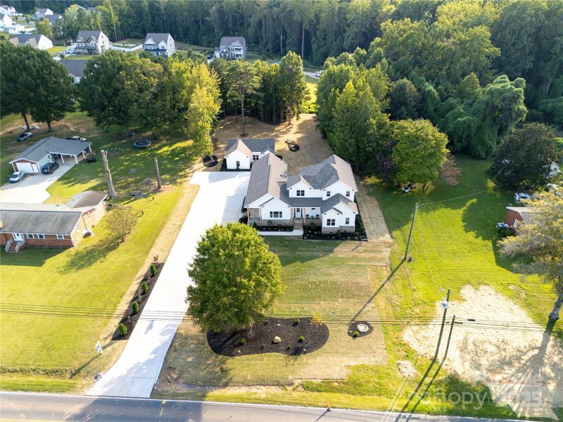Sits on 1.15 acres with a main home and 2nd Living Quarters
