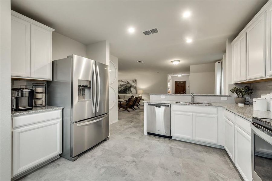 Spacious kitchen  *Photos of furnished model. Not actual home. Representative of floor plan. Some options and features may vary.