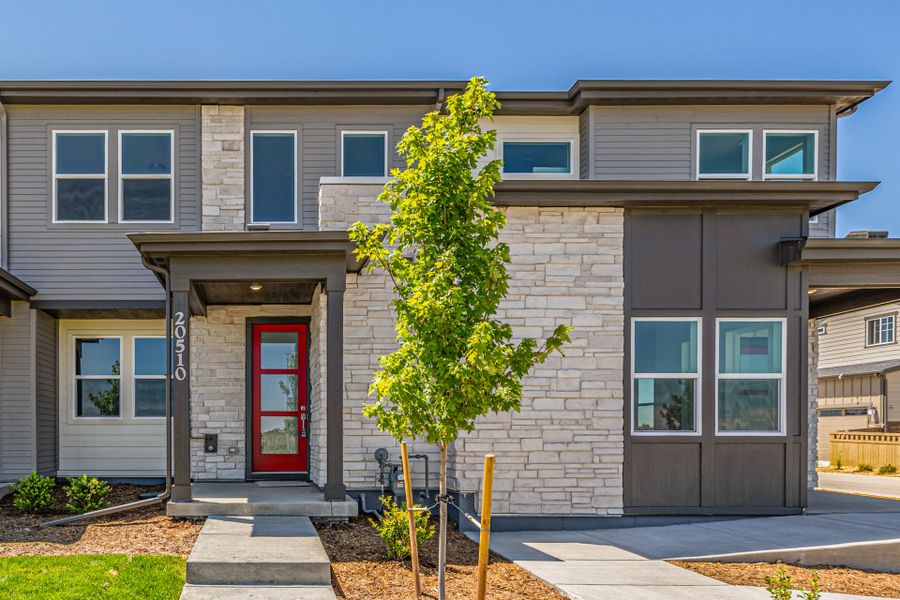 Front exterior of a new home in Painted Prairie, Aurora, CO, highlighting curb appeal (Image 2).