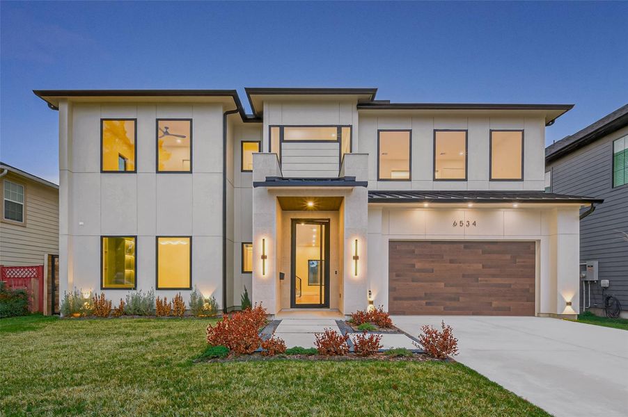 Welcome to 6534 Corbinn St. This striking modern exterior offers sleek lines, large windows, and a welcoming covered entryway.