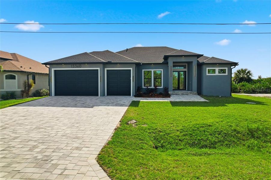 Front exterior of a new home in , Port Charlotte, FL, highlighting curb appeal (Image 28). Front exterior of a new home in , Port Charlotte, FL, highlighting curb appeal (Image 28).