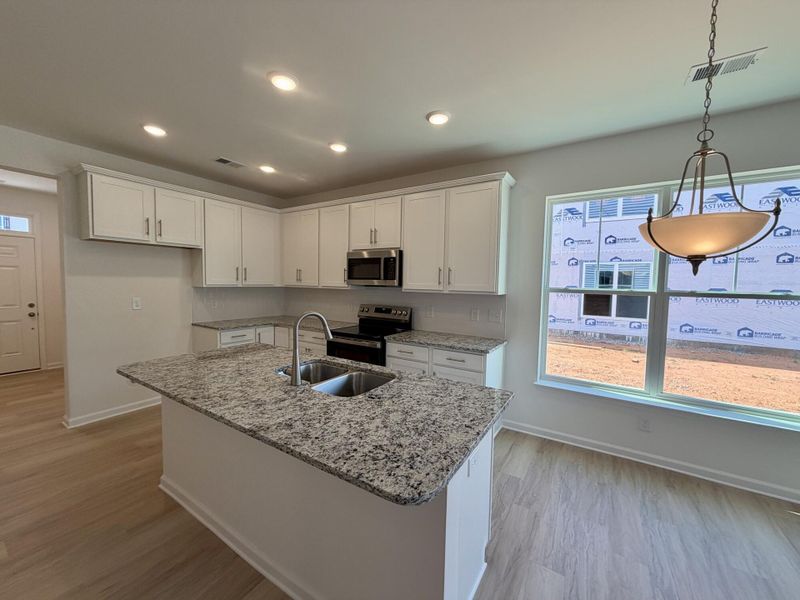 Furnished interior view inside a new home in Bellevue Townhomes, Greenville (Image 5).