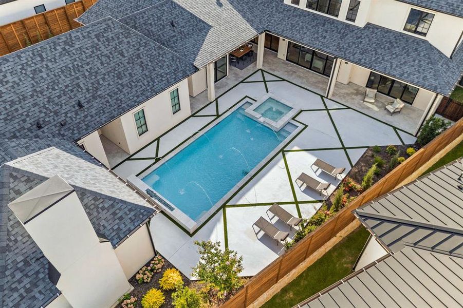 View of pool with a fenced backyard, a patio area, and a pool with connected hot tub View of pool with a fenced backyard, a patio area, and a pool with connected hot tub