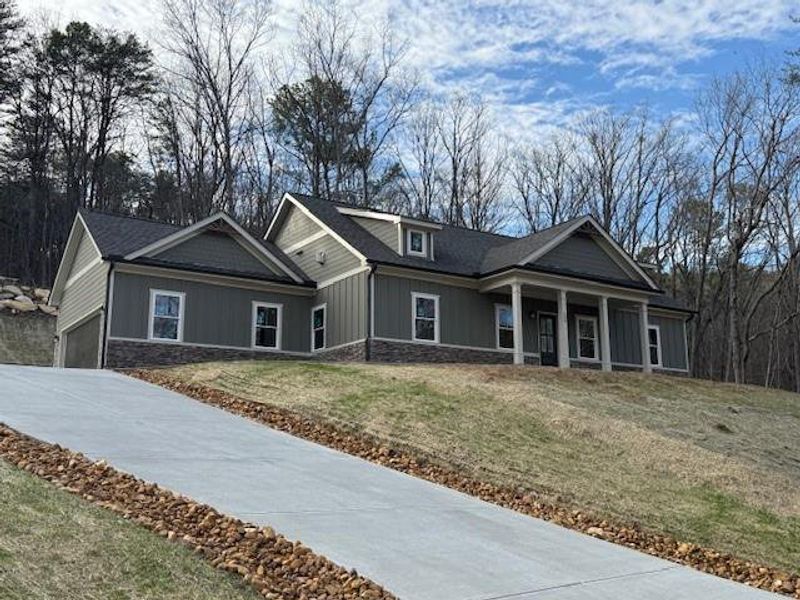 Front exterior of a new home in , Waleska, GA, highlighting curb appeal (Image 1). Front exterior of a new home in , Waleska, GA, highlighting curb appeal (Image 1).