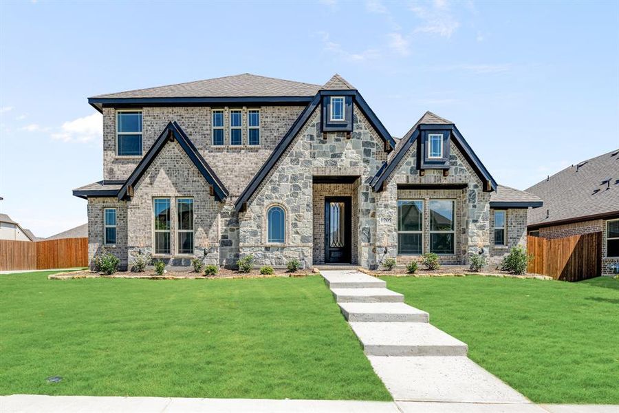 Front exterior of a new home in Trees Farm, DeSoto, TX, highlighting curb appeal (Image 24). Front exterior of a new home in Trees Farm, DeSoto, TX, highlighting curb appeal (Image 24).