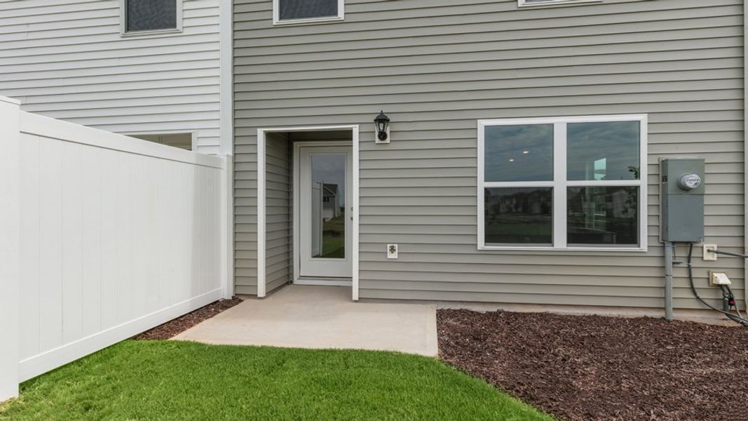 Exterior details and patio area of a home in The Townes at Hunter Hill, Rocky Mount (Image 4).