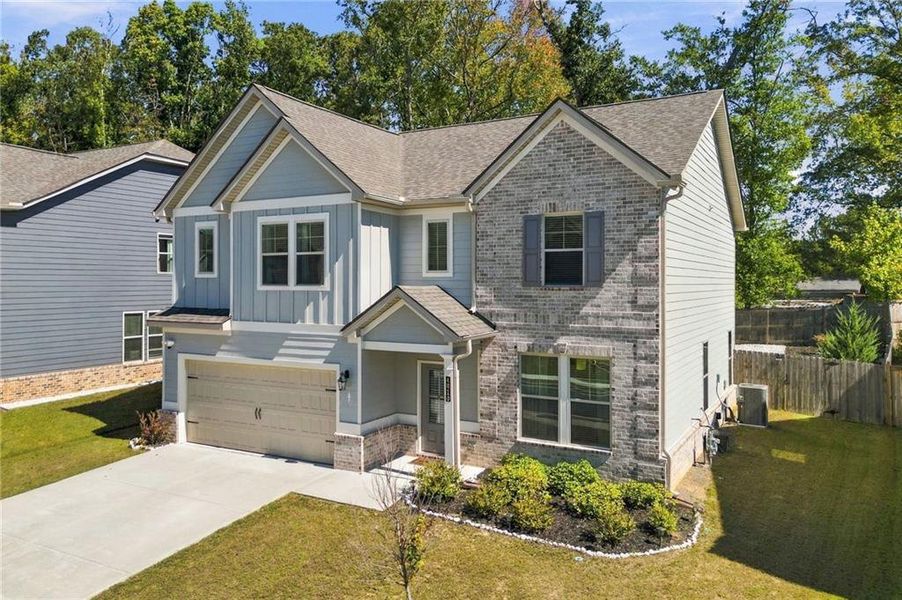 Front exterior of a new home in Dixon Farm, Fayetteville, GA, highlighting curb appeal (Image 26). Front exterior of a new home in Dixon Farm, Fayetteville, GA, highlighting curb appeal (Image 26).