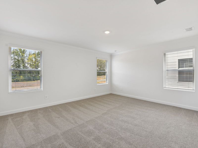 Relax and unwind after a long day in the primary bedroom. Relax and unwind after a long day in the primary bedroom.