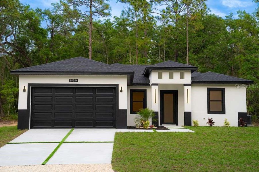 Front exterior of a new home in , Brooksville, FL, highlighting curb appeal (Image 19).