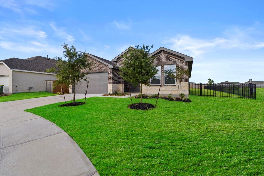 Front exterior of a new home in , Dayton, TX, highlighting curb appeal (Image 2). Front exterior of a new home in , Dayton, TX, highlighting curb appeal (Image 2).