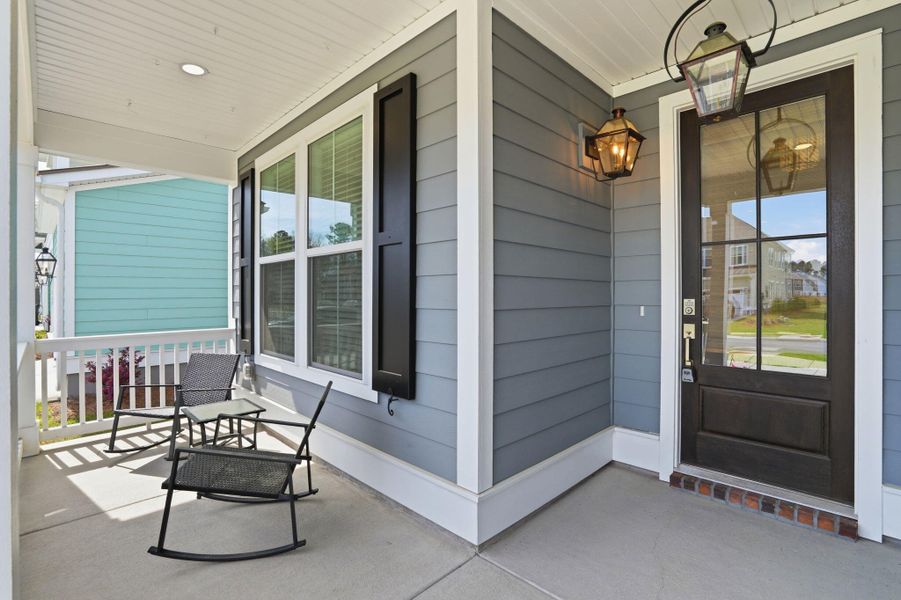 Exterior details and patio area of a home in Tidewater at Lakes of Cane Bay, Summerville (Image 3).