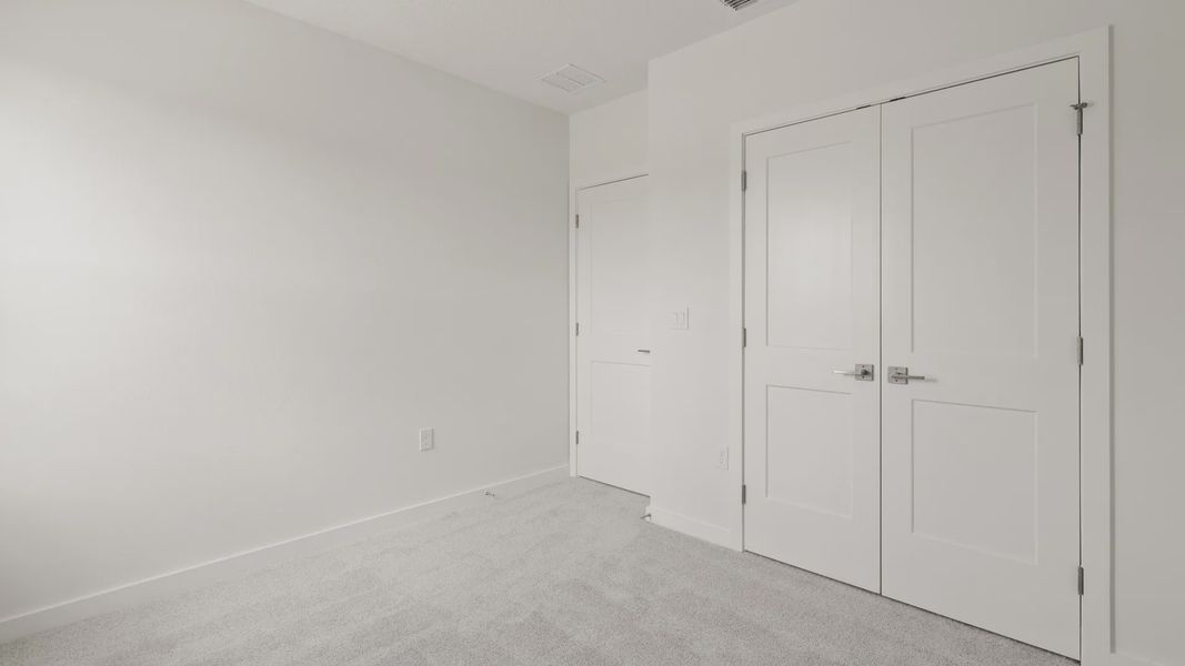 Furnished interior view inside a new home in Grasslands West, Lakeland (Image 11).
