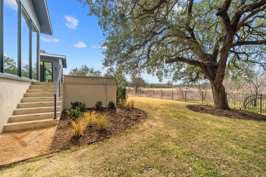 Fenced yard with stairway