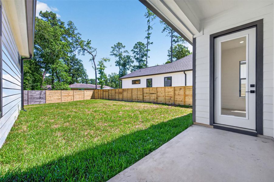 Exterior details and patio area of a home in , Conroe (Image 29).