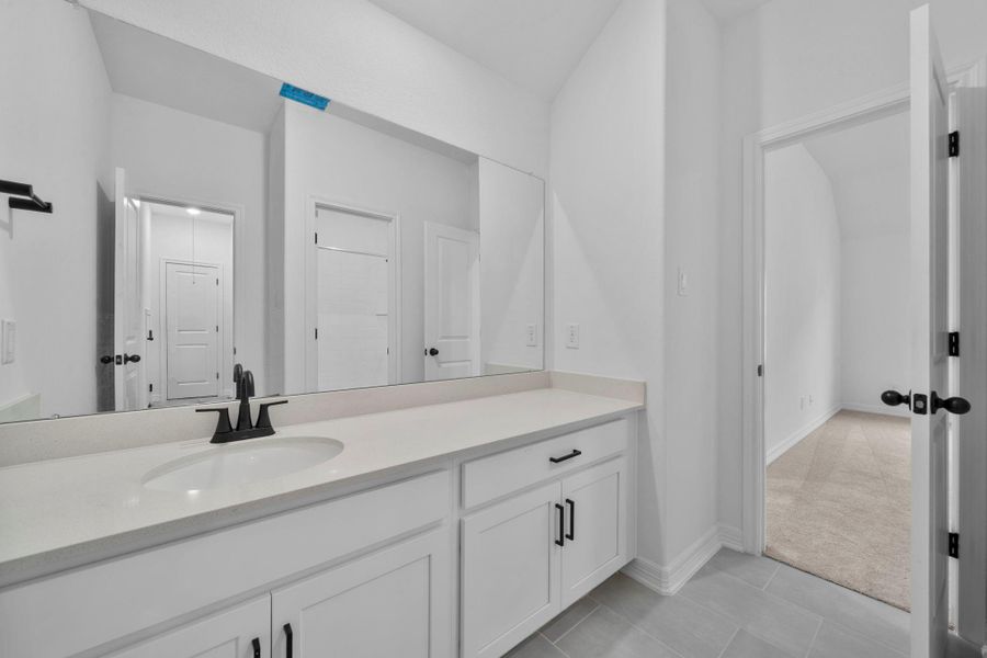 Designed for daily use, this secondary bathroom feels both functional and welcoming.