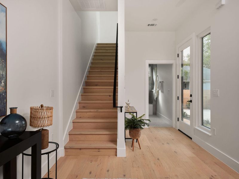 Stairway with wood finished floors and baseboards Stairway with wood finished floors and baseboards