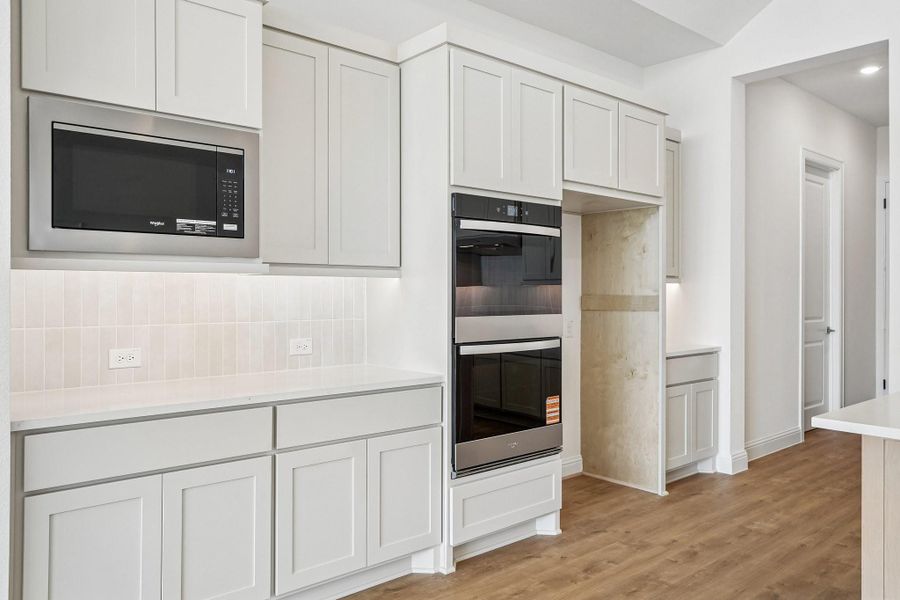 Furnished interior view inside a new home in Del Bello Lakes 60', Manvel (Image 10).
