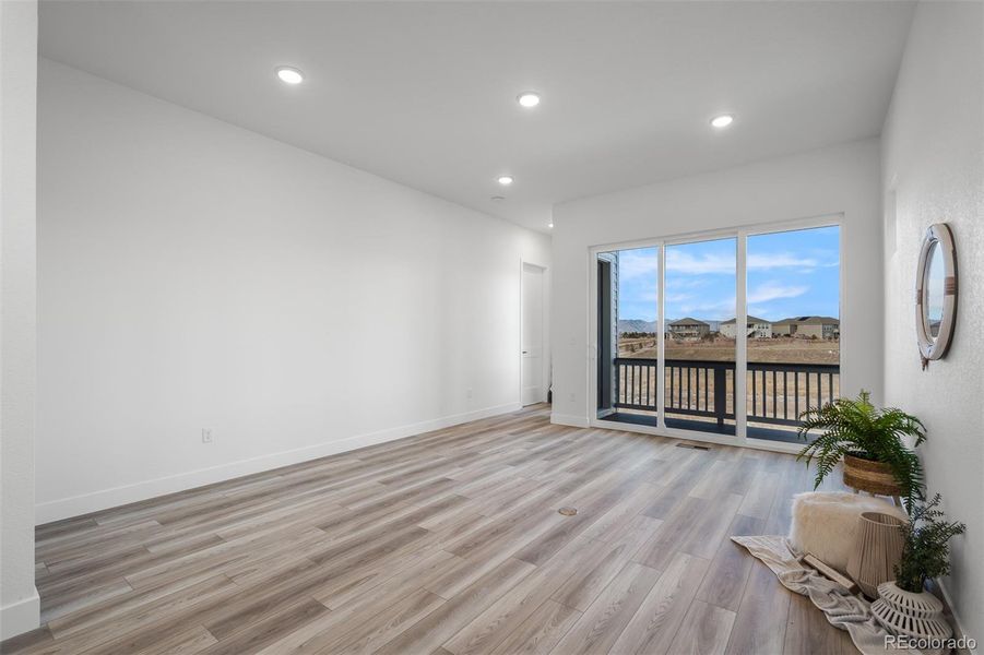 Spacious, unfurnished interior of a new home in Revel Crossing at Wolf Ranch - The Panorama Collection, Colorado Springs (Image 28).