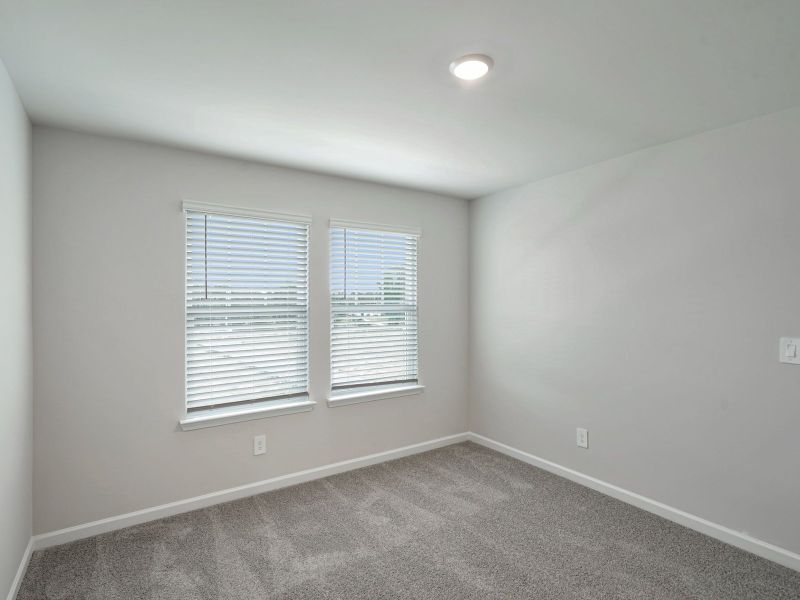 Secondary Bedroom in the Thompson floorplan at a Meritage Homes community in Atlanta, GA.