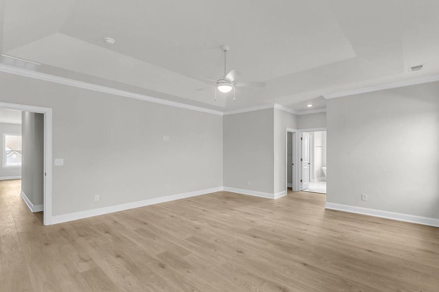 Spacious, unfurnished interior of a new home in Tidewater at Lakes of Cane Bay, Summerville (Image 57).