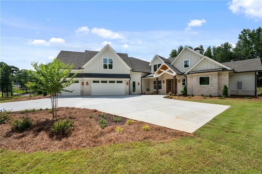 Front exterior of a new home in , Loganville, GA, highlighting curb appeal (Image 1). Front exterior of a new home in , Loganville, GA, highlighting curb appeal (Image 1).
