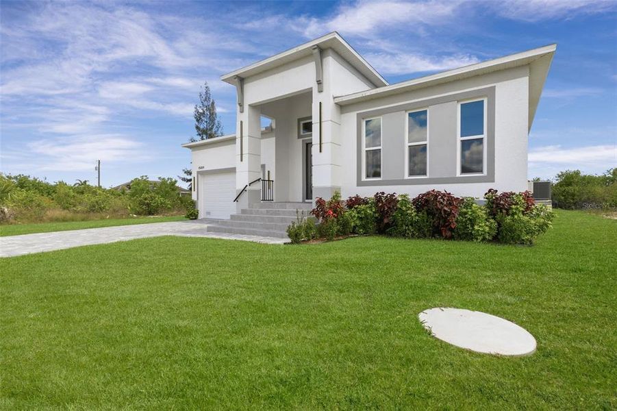 Front exterior of a new home in , Port Charlotte, FL, highlighting curb appeal (Image 29).