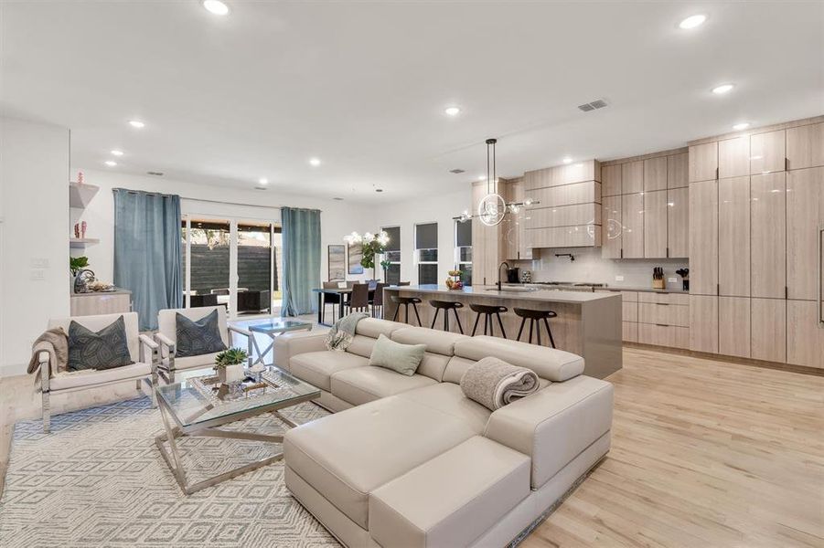 Living room featuring light hardwood / wood-style flooring and sink