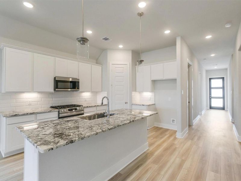 Furnished interior view inside a new home in Sunterra, Katy (Image 6).