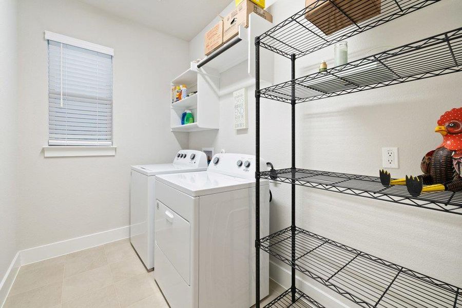 Dedicated laundry room with ample space.
