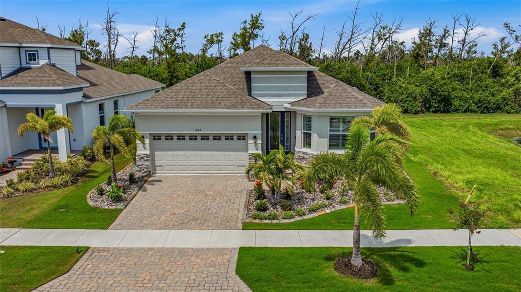 Front exterior of a new home in , Apollo Beach, FL, highlighting curb appeal (Image 21). Front exterior of a new home in , Apollo Beach, FL, highlighting curb appeal (Image 21).