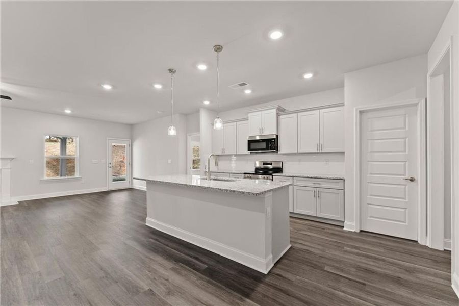 Furnished interior view inside a new home in Wood Creek Landing, Leland (Image 3).