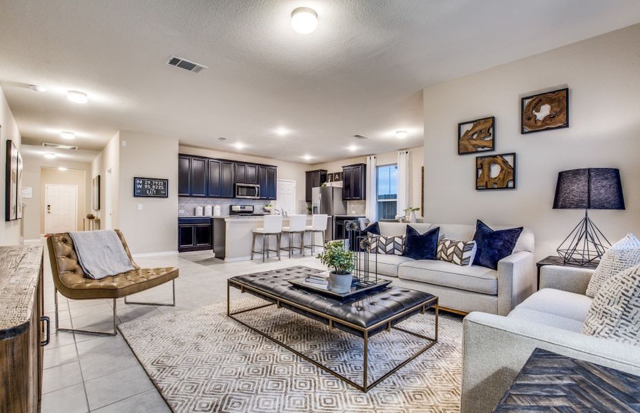 Spacious gathering room with view of kitchen