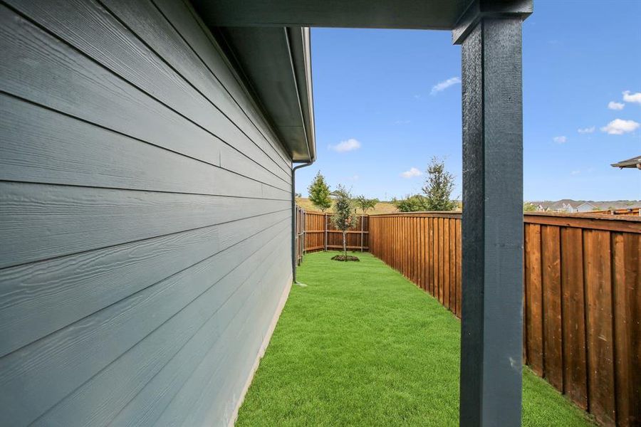 Exterior details and patio area of a home in Karis - Cottage Series, Crowley (Image 2).