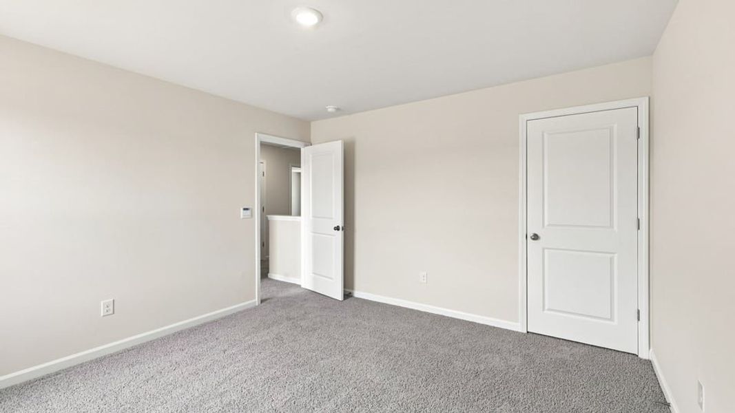 Spacious, unfurnished interior of a new home in Bentley Park, Greenwood (Image 23).
