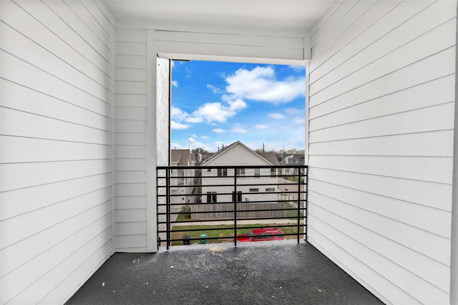 Just off the main bedroom, this private balcony offers an even better view of the neighborhood, perfect for relaxing and enjoying the scenery. Just off the main bedroom, this private balcony offers an even better view of the neighborhood, perfect for relaxing and enjoying the scenery.