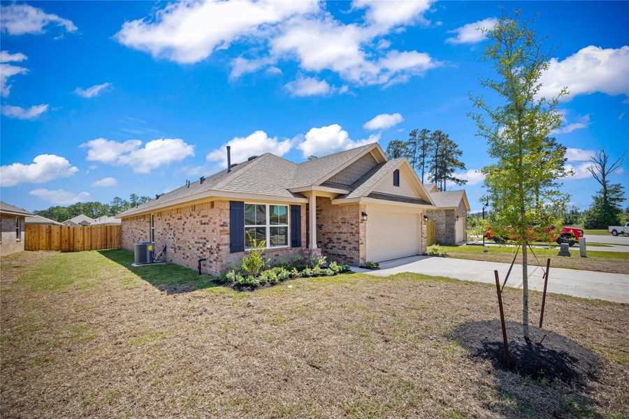 Front exterior of a new home in Grand Oaks Reserve, Cleveland, TX, highlighting curb appeal (Image 10). Front exterior of a new home in Grand Oaks Reserve, Cleveland, TX, highlighting curb appeal (Image 10).