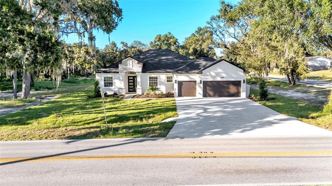 Front exterior of a new home in , Lakeland, FL, highlighting curb appeal (Image 27).