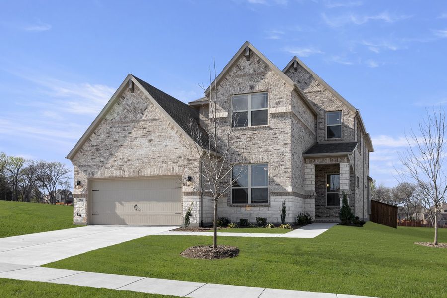 Front exterior of a new home in Providence Cove, McKinney, TX, highlighting curb appeal (Image 2). Front exterior of a new home in Providence Cove, McKinney, TX, highlighting curb appeal (Image 2).