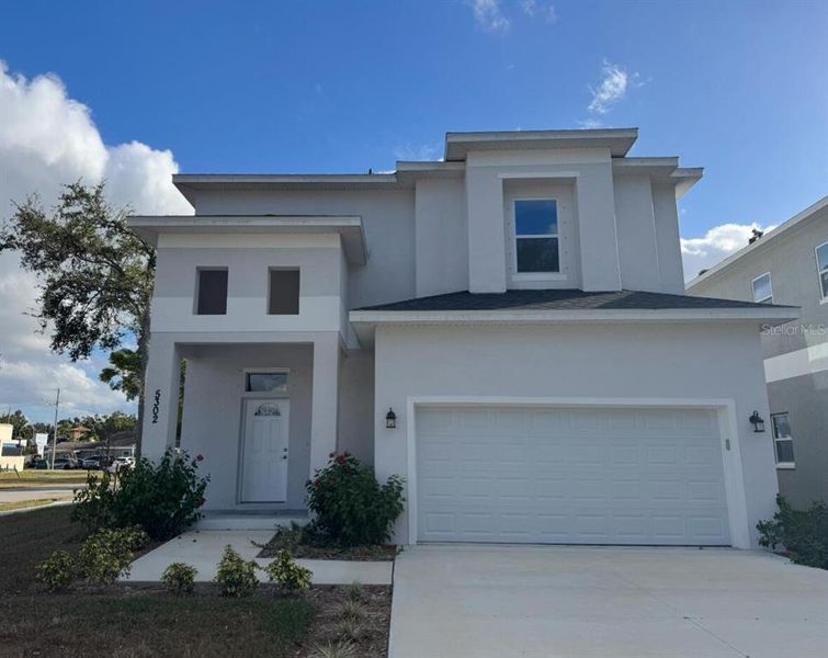 Front exterior of a new home in , Pinellas Park, FL, highlighting curb appeal (Image 1).
