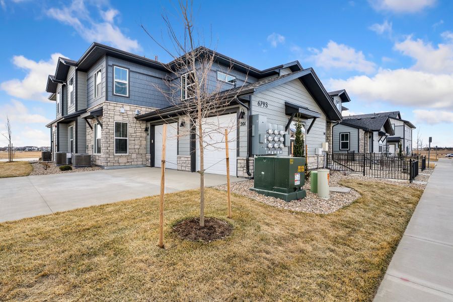 Front exterior of a new home in Wilder at Timnath Ranch, Timnath, CO, highlighting curb appeal (Image 2). Front exterior of a new home in Wilder at Timnath Ranch, Timnath, CO, highlighting curb appeal (Image 2).