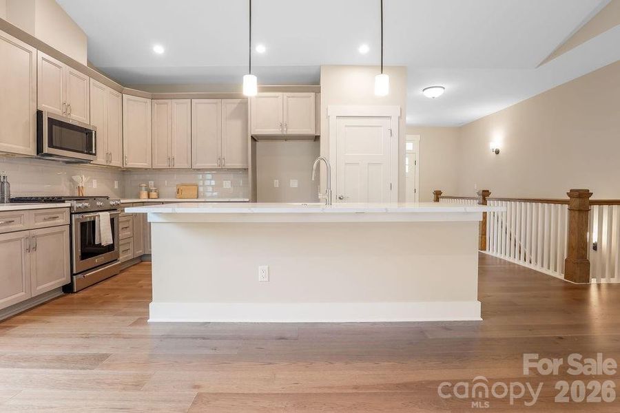 Large kitchen island opens into great room