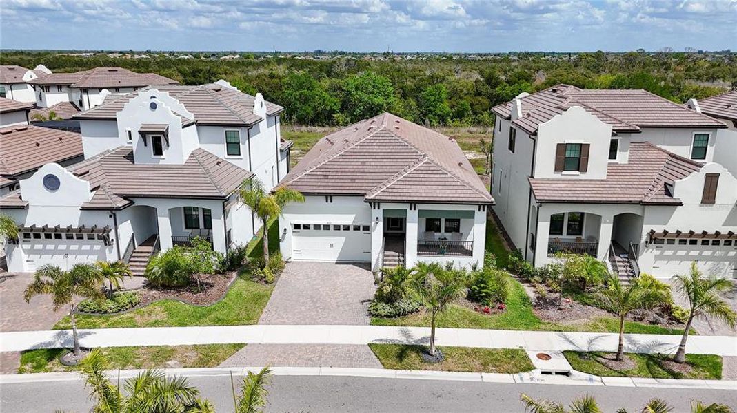 Front exterior of a new home in SouthShore Yacht Club, Ruskin, FL, highlighting curb appeal (Image 30). Front exterior of a new home in SouthShore Yacht Club, Ruskin, FL, highlighting curb appeal (Image 30).