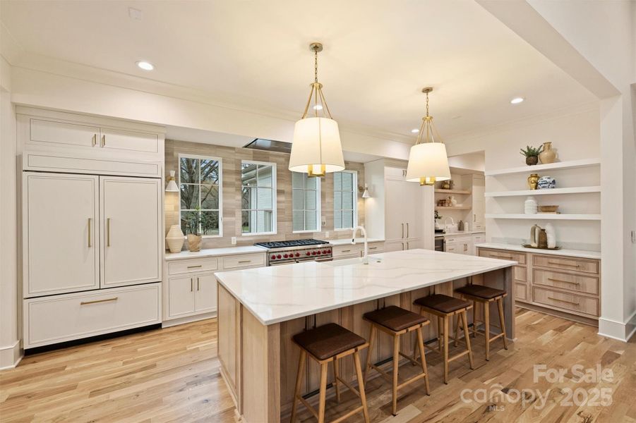 This dreamy kitchen also features paneled appliances, including a Sub-Zero refrigerator.