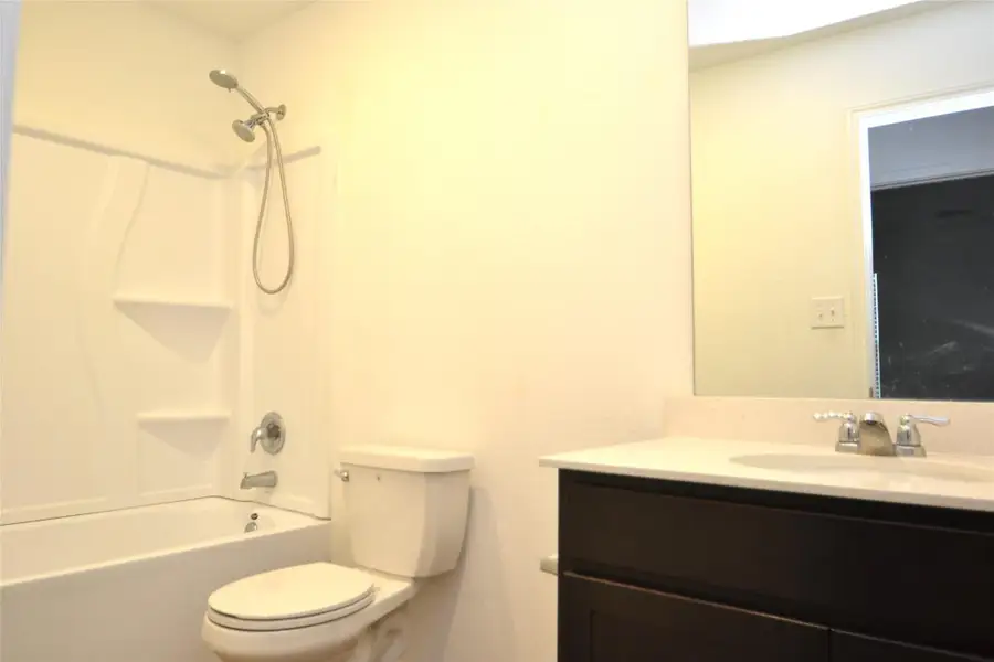 Bathroom featuring vanity and bathing tub / shower combination