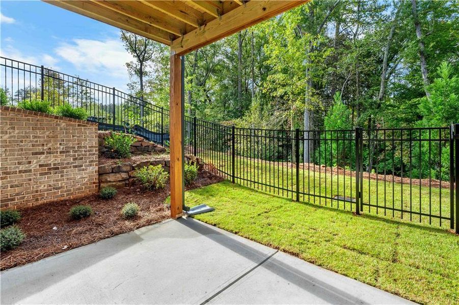 Exterior details and patio area of a home in Ward's Crossing Townhomes, Johns Creek (Image 30). Exterior details and patio area of a home in Ward's Crossing Townhomes, Johns Creek (Image 30).