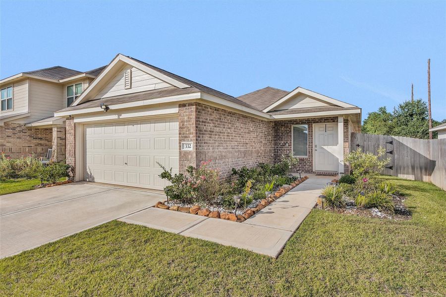 Front exterior of a new home in , Sealy, TX, highlighting curb appeal (Image 22). Front exterior of a new home in , Sealy, TX, highlighting curb appeal (Image 22).