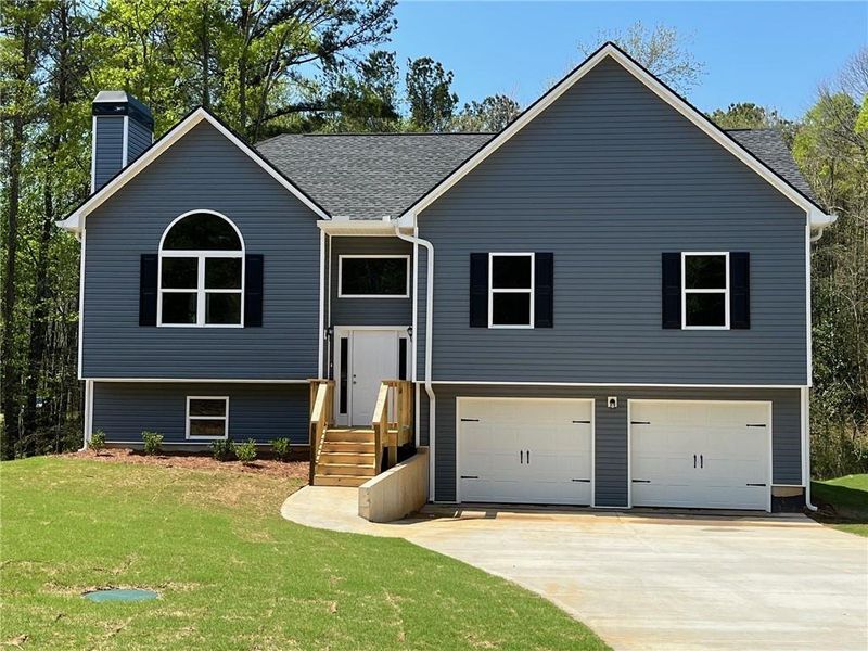 Front exterior of a new home in , Dallas, GA, highlighting curb appeal (Image 1). Front exterior of a new home in , Dallas, GA, highlighting curb appeal (Image 1).
