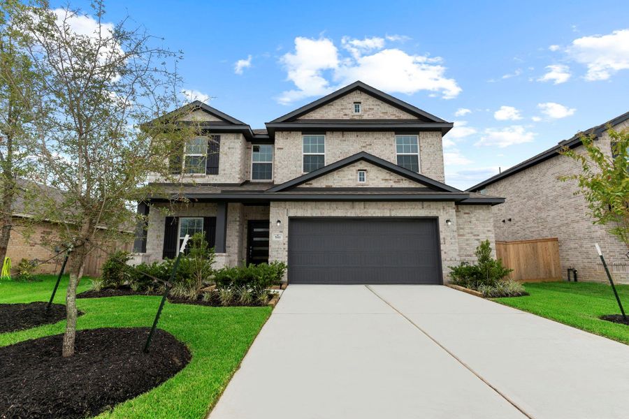 Welcome to this beautifully crafted Trinity plan by CastleRock Communities, showcasing exceptional curb appeal with a full-brick façade, charming covered front porch, and a wide 2.5-car garage—perfectly situated on a lush, landscaped lot in the sought-after Massey Oaks community.